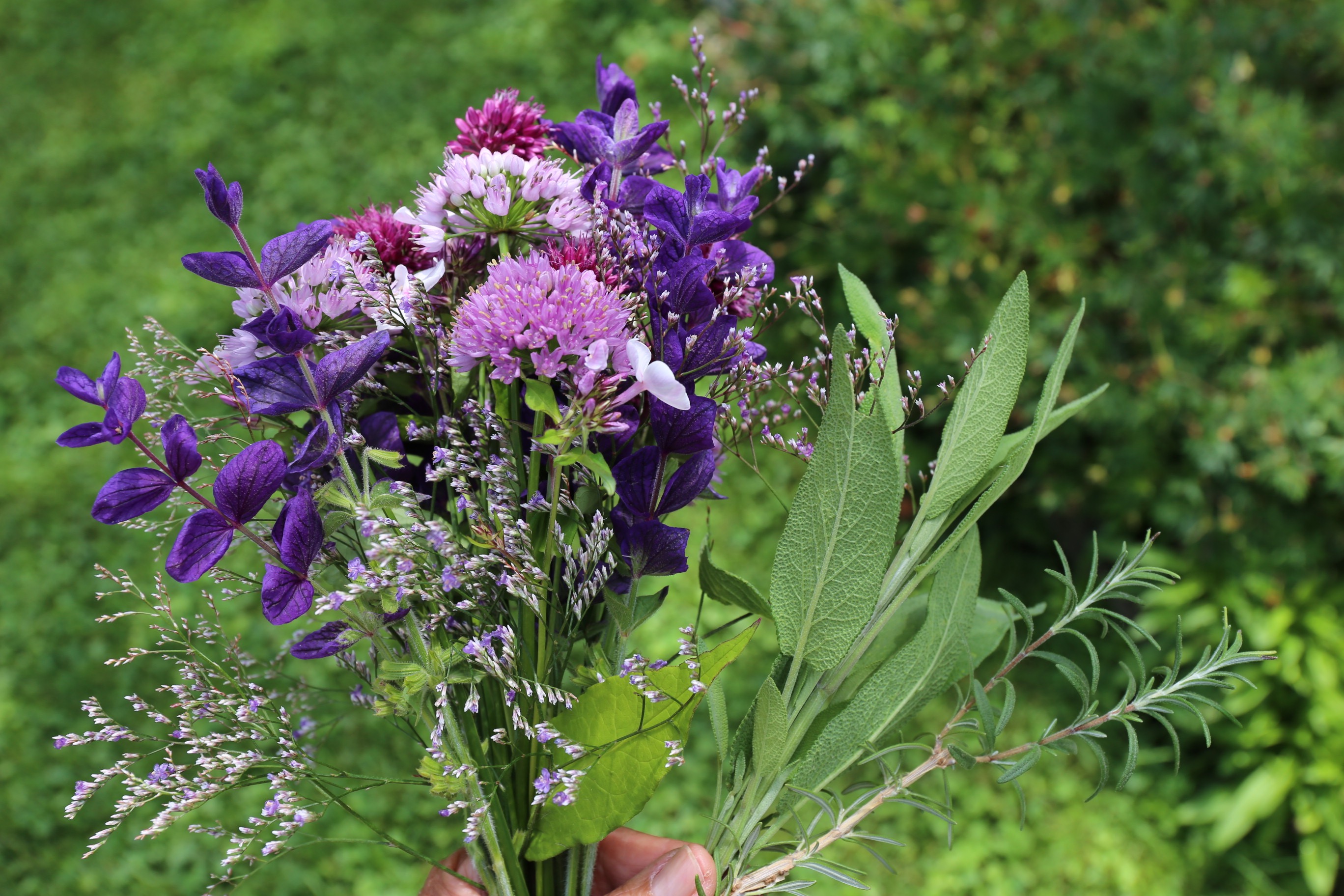 adding foliage to flower arrangement